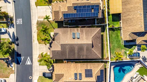 an aerial view of residential houses with outdoor space