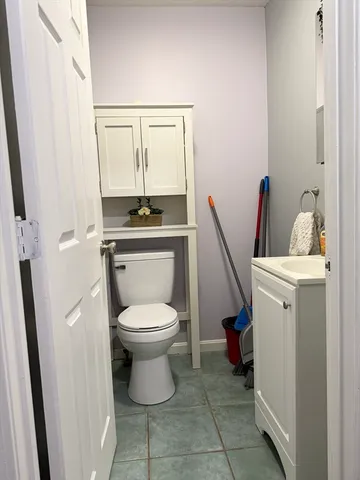 a bathroom with a toilet and a sink