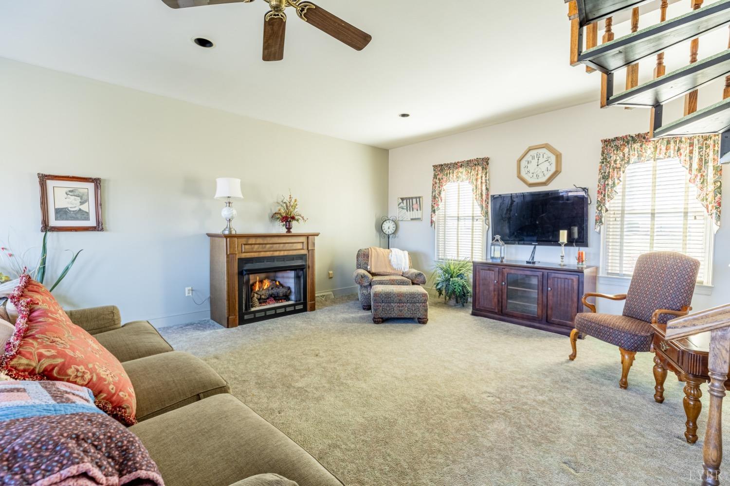 3755 Perrowville Road Forest, VA 24551 - Photo 54 of 60 a living room with furniture and a fireplace