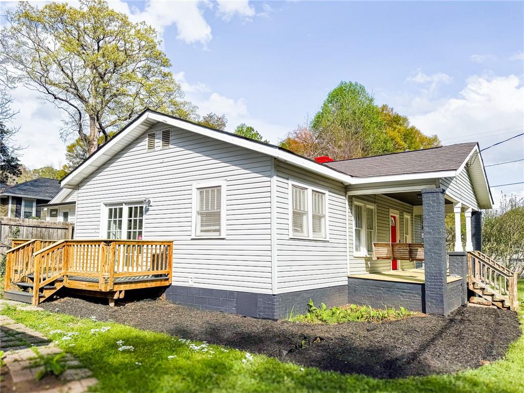 1735 Spring Avenue East Point, GA 30344 - Photo 2 of 9 a view of a house with a backyard and a patio