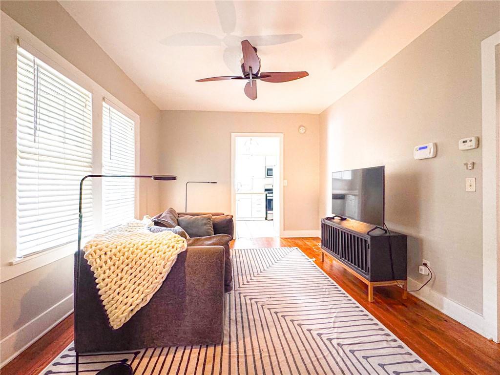 1735 Spring Avenue East Point, GA 30344 - Photo 3 of 9 a bedroom with wooden floor and a bed