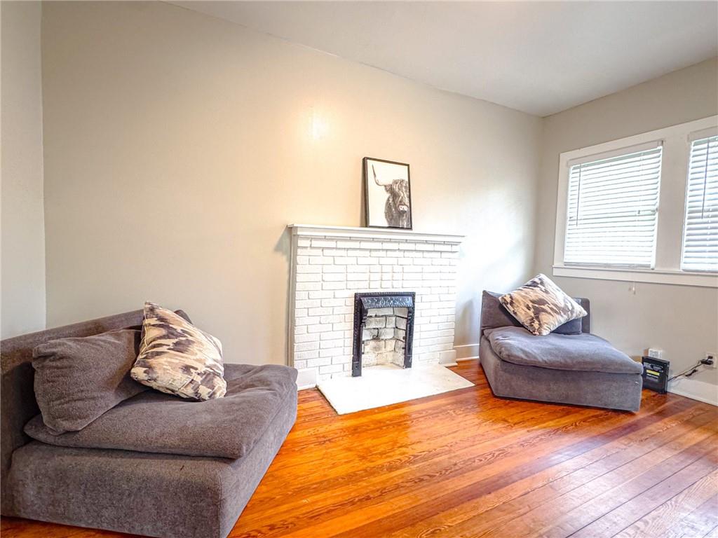 1735 Spring Avenue East Point, GA 30344 - Photo 4 of 9 a living room with furniture and a fireplace