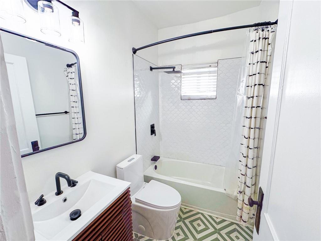 1735 Spring Avenue East Point, GA 30344 - Photo 7 of 9 a bathroom with a sink toilet and shower