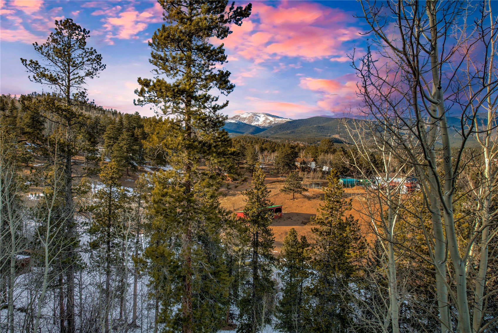 637 Rock Road Bailey, CO 80421 - Photo 1 of 50 Incredible views with Rosalie Peak in the distance and the barn and pasture in the foreground on this 9+ acre mountain sanctuary.