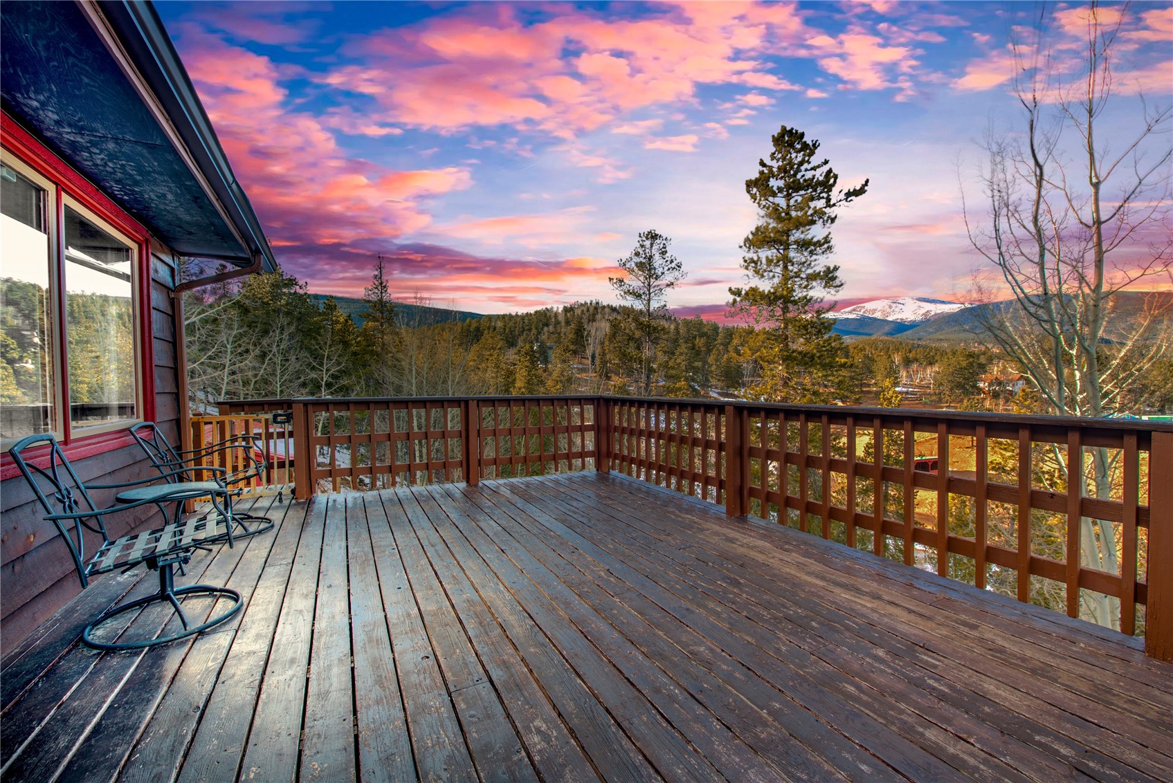 637 Rock Road Bailey, CO 80421 - Photo 3 of 50 Giant wrap around deck that frames the mountain views.