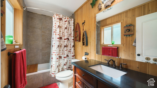 180 North State Street Sigurd, UT 84657 - Photo 29 of 32 Bathroom with vanity, a tile shower, and wooden walls