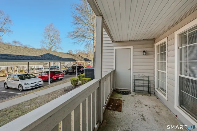 a view of a car park in front of house