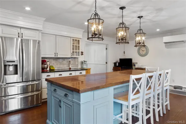 a kitchen with cabinets and stainless steel appliances