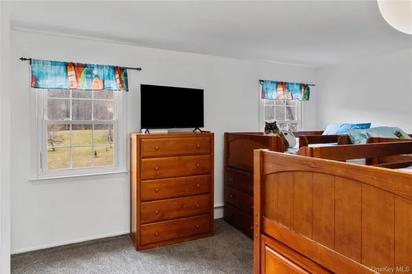 a room with furniture and a flat screen tv