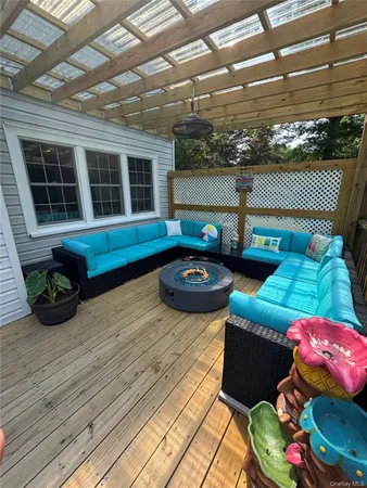 a front view of a house with outdoor seating