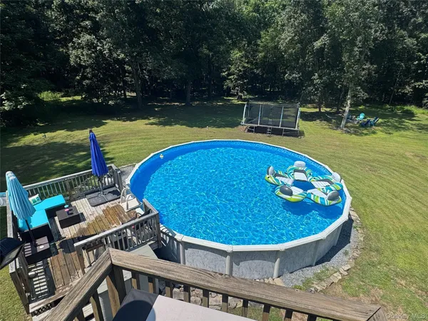 a view of a swimming pool with a patio