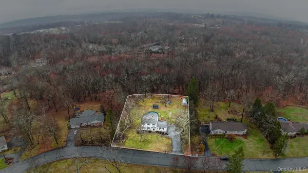 an aerial view of a house with a garden