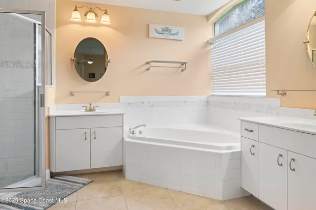 a bathroom with a sink a mirror and a bathtub