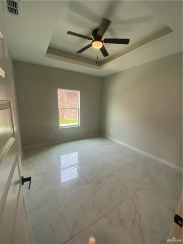 a view of empty room with windows