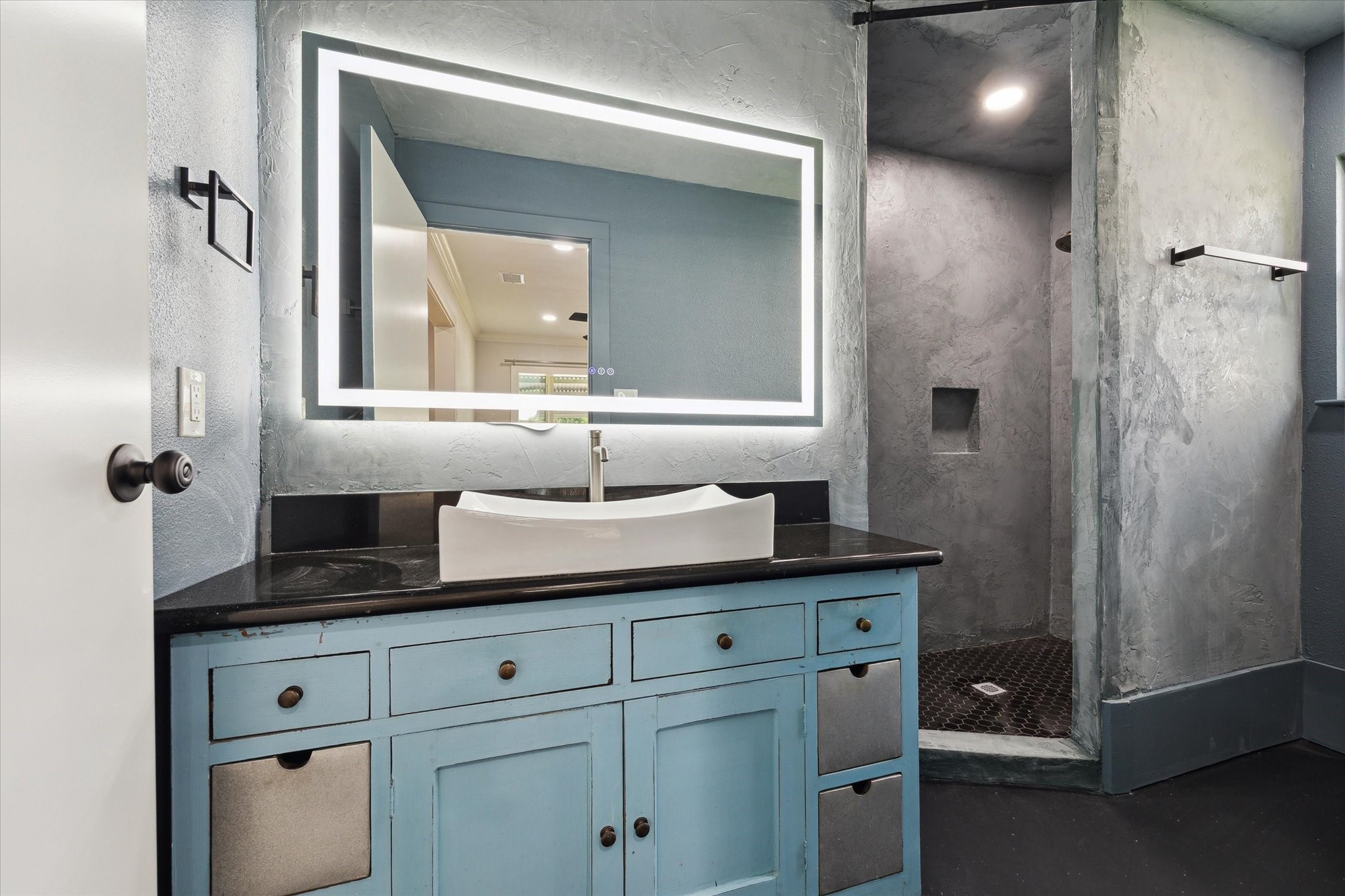 522 Barkley Street Houston, TX 77022 - Photo 13 of 18 Newly added full bathroom with black lit LED vanity mirror, vanity with ample storage, and custom shower.