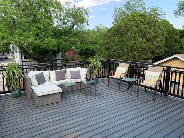 a view of sitting area with furniture and wooden floor