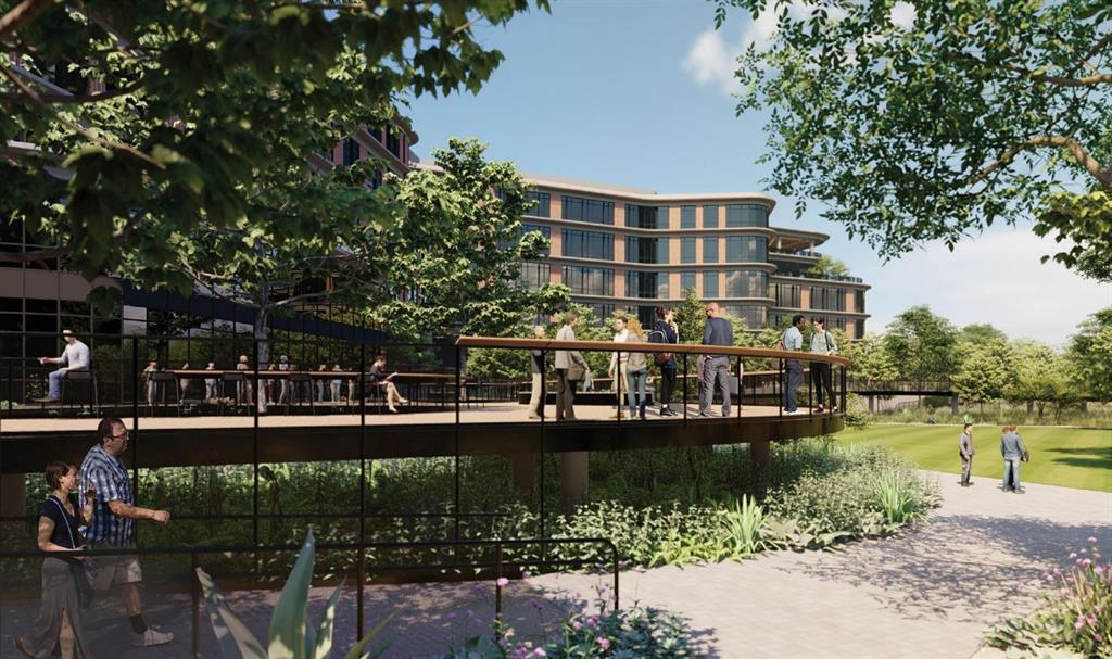 4709 Prock Lane, Unit B Austin, TX 78721 - Photo 12 of 17 a view of a lake with a building and trees in the background