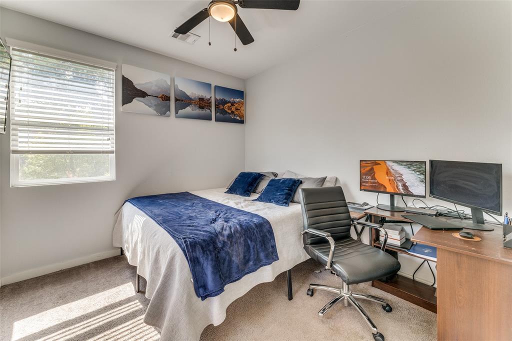 4709 Prock Lane, Unit B Austin, TX 78721 - Photo 7 of 17 a bedroom with a workspace and a window