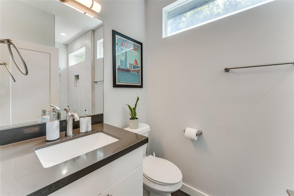 4709 Prock Lane, Unit B Austin, TX 78721 - Photo 10 of 17 a bathroom with a sink a toilet and mirror