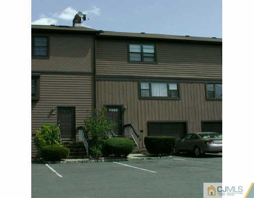 7005 Hana Road Edison, NJ 08817 - Photo 1 of 8 a front view of a house with a yard