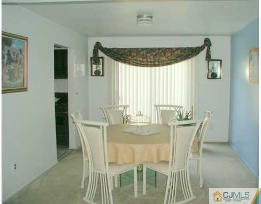 7005 Hana Road Edison, NJ 08817 - Photo 3 of 8 a dining room with furniture and window
