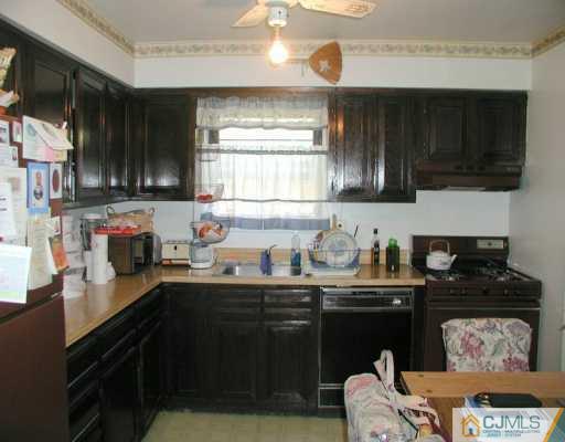 7005 Hana Road Edison, NJ 08817 - Photo 4 of 8 a kitchen with a sink and a stove