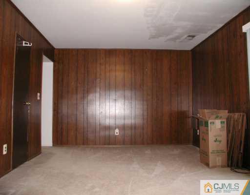 7005 Hana Road Edison, NJ 08817 - Photo 7 of 8 an empty room with windows