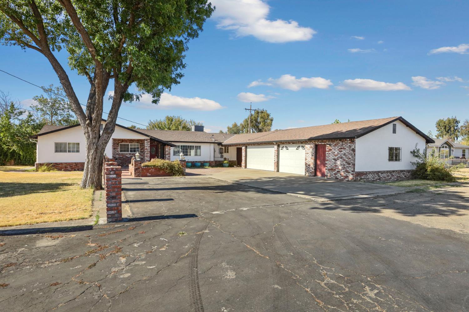 5791 Carpenter Road Stockton, CA 95215 - Photo 1 of 1 a front view of house with a garden