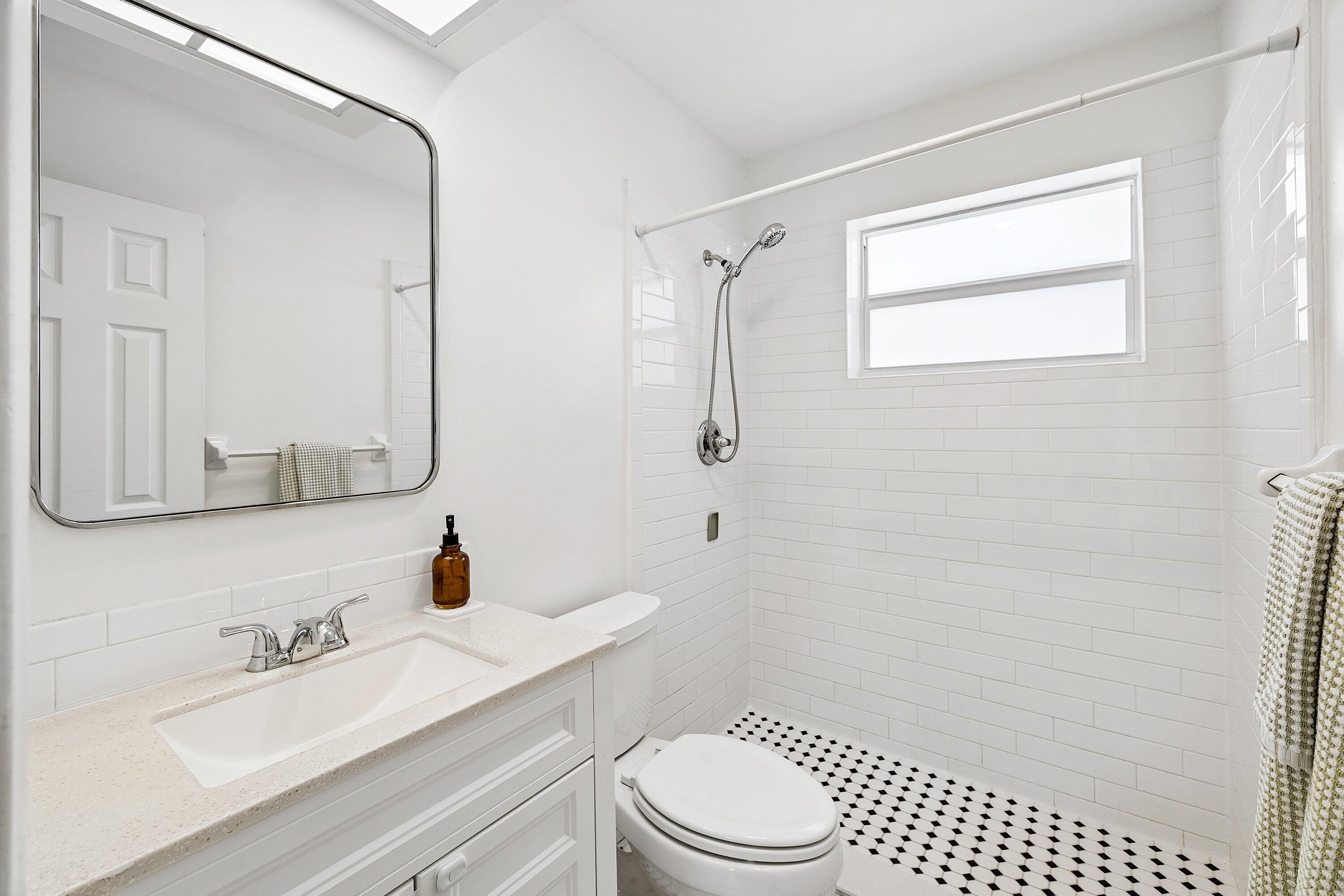 774 Southwest 7th Street Boca Raton, FL 33486 - Photo 21 of 28 a bathroom with a sink a toilet and shower