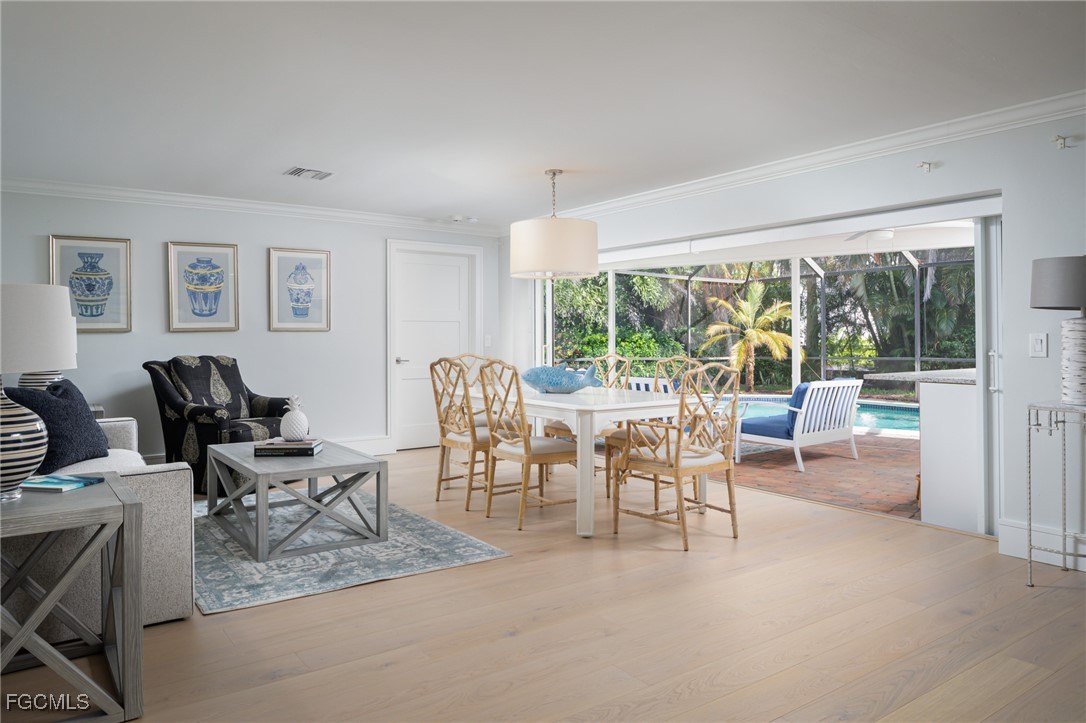 635 Fountainhead Lane Naples, FL 34103 - Photo 13 of 28 a living room with furniture and a large window