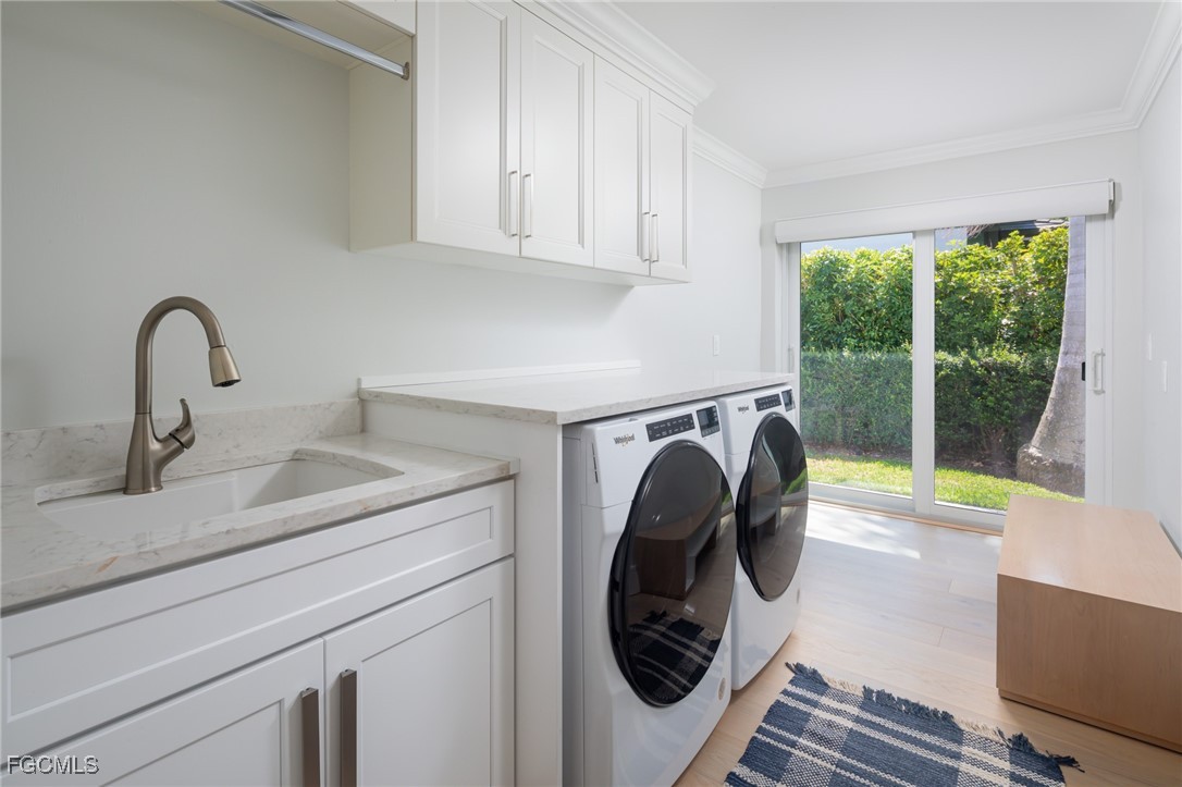 635 Fountainhead Lane Naples, FL 34103 - Photo 27 of 28 a utility room with sink dryer and washer