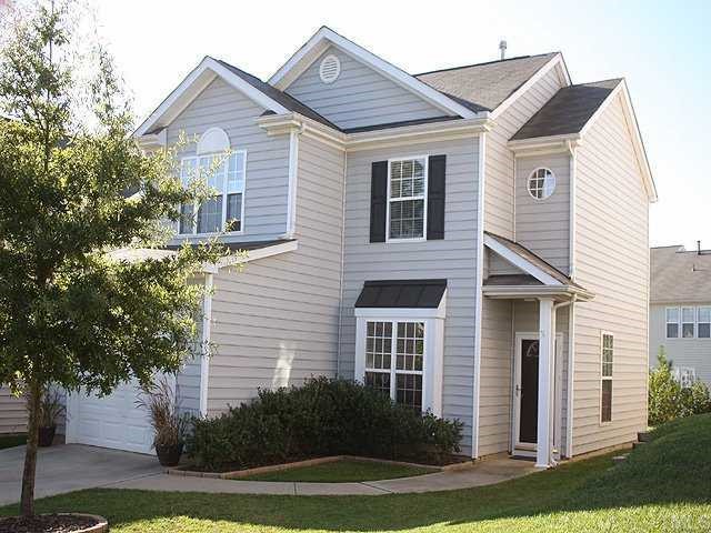 8333 Tie Stone Way Raleigh, NC 27613 - Photo 2 of 12 a front view of a house with a yard and garage