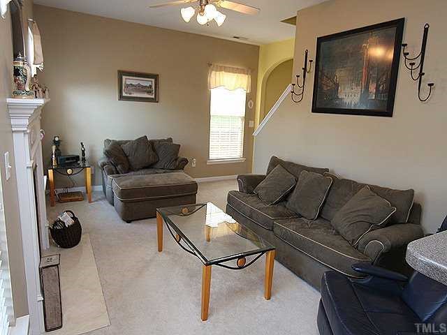 8333 Tie Stone Way Raleigh, NC 27613 - Photo 3 of 12 a living room with furniture and a flat screen tv