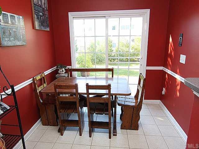 8333 Tie Stone Way Raleigh, NC 27613 - Photo 8 of 12 a view of a dining room with furniture and a window
