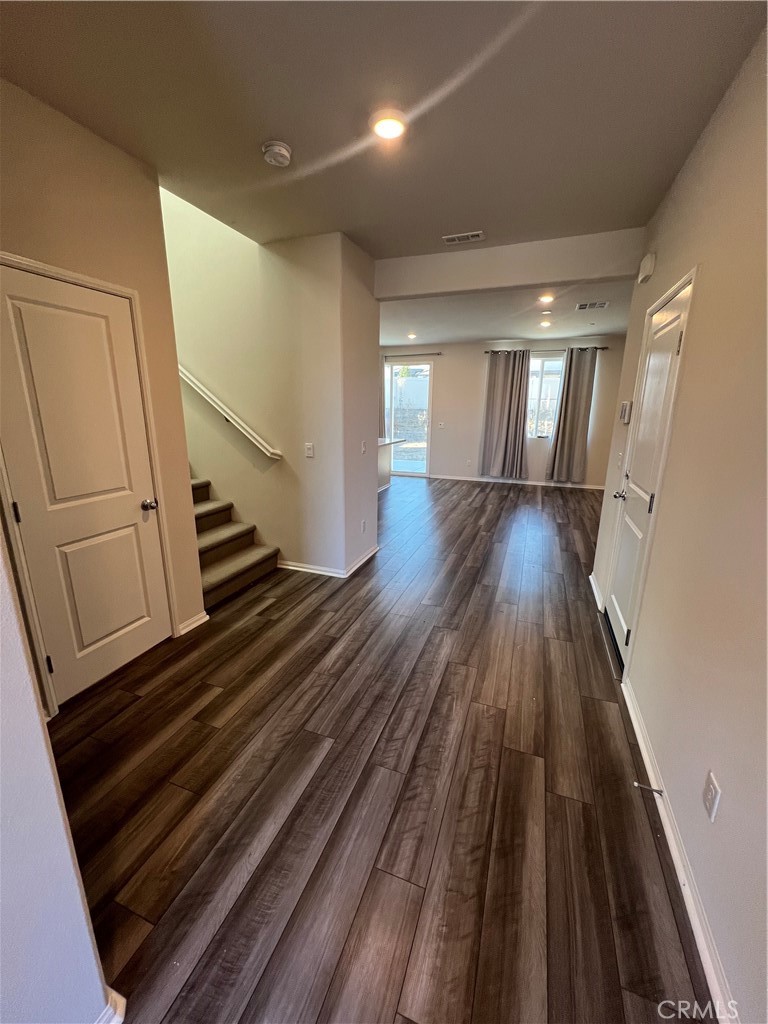 29837 Warrior Way Menifee, CA 92584 - Photo 3 of 18 a view of wooden floor in an empty room