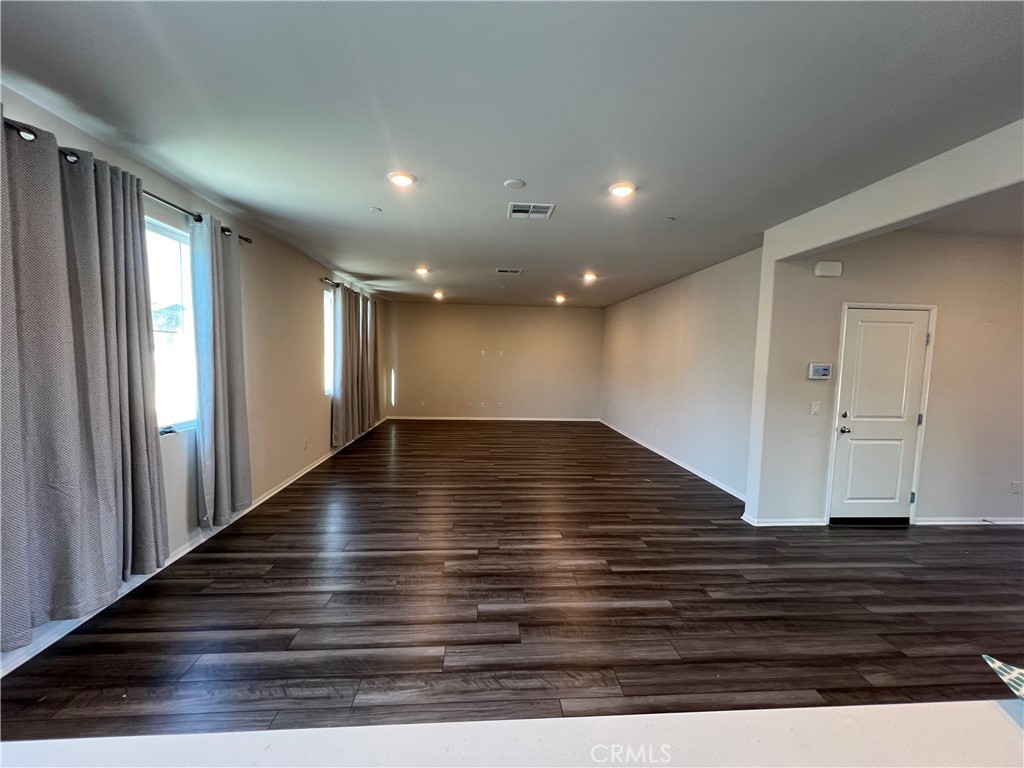 29837 Warrior Way Menifee, CA 92584 - Photo 6 of 18 a view of room with wooden floor