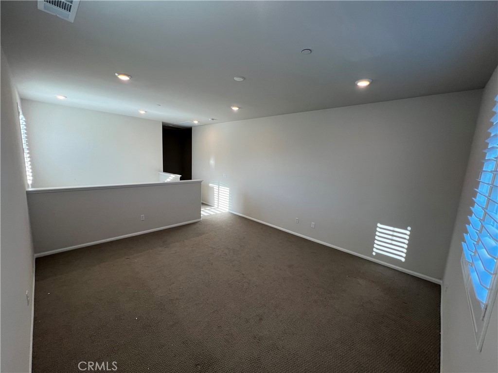 29837 Warrior Way Menifee, CA 92584 - Photo 10 of 18 an empty room with windows