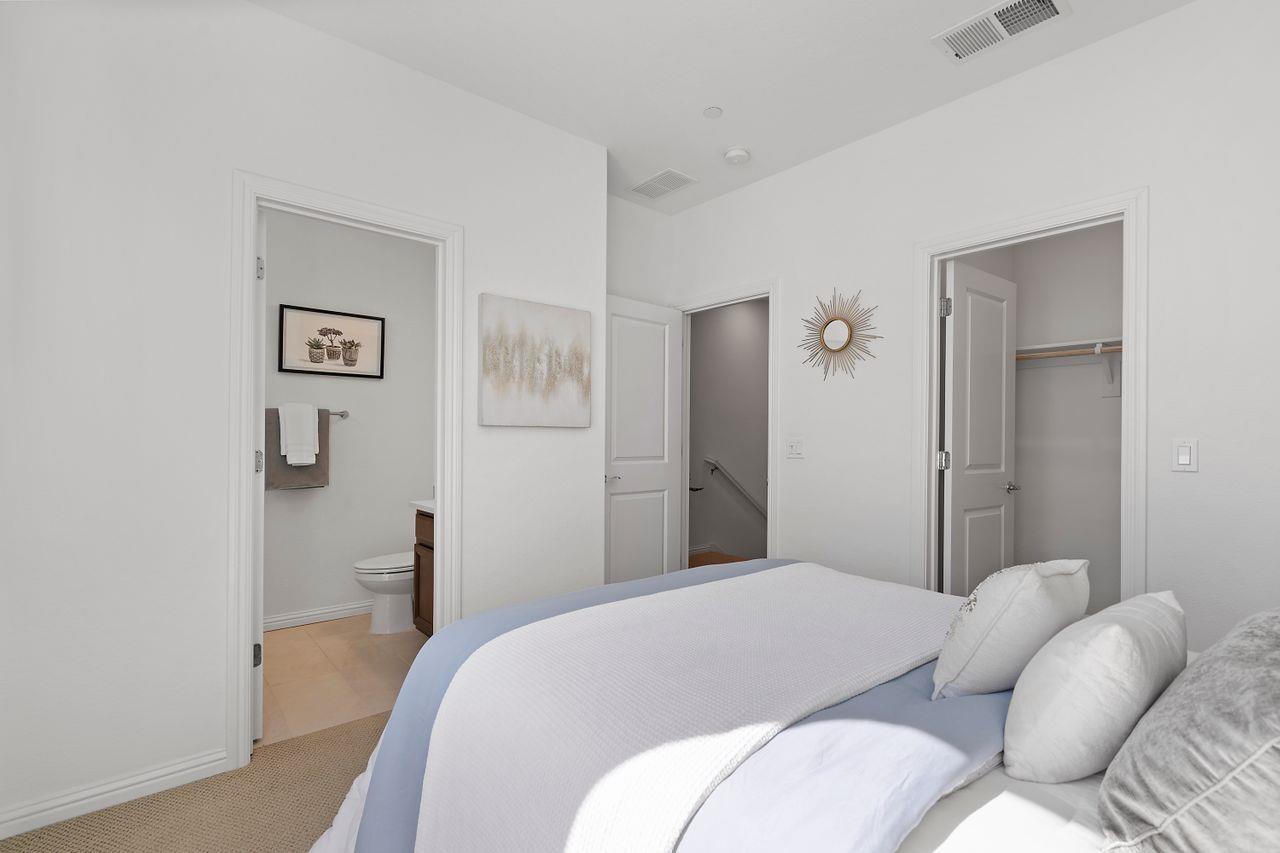 718 Fruit Ranch Loop San Jose, CA 95133 - Photo 20 of 36 a bedroom with a bed and a couch