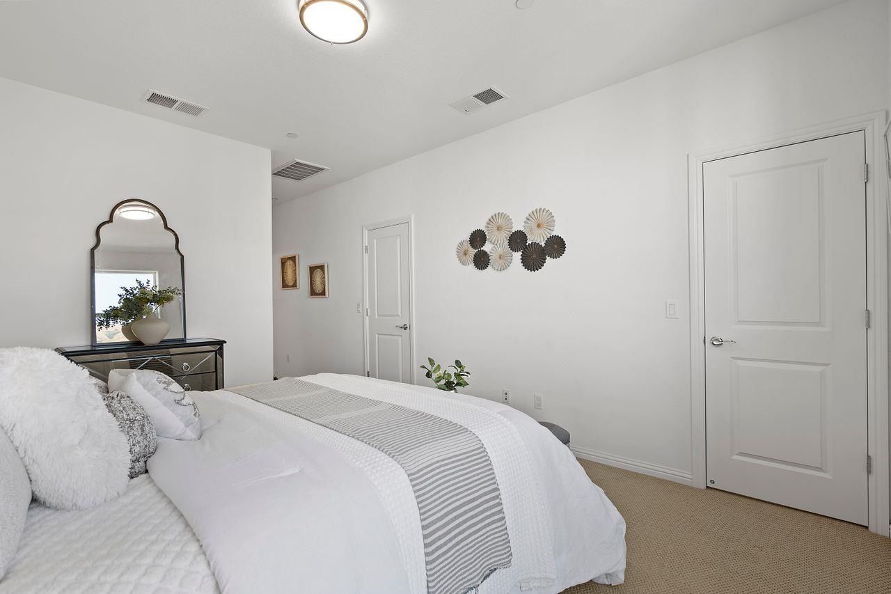 718 Fruit Ranch Loop San Jose, CA 95133 - Photo 22 of 36 a bedroom with a bed and a mirror