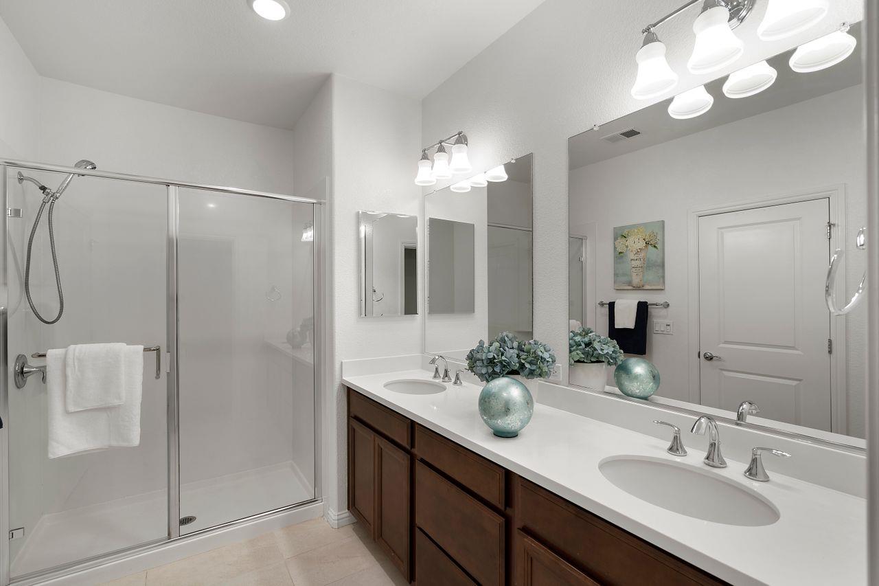 718 Fruit Ranch Loop San Jose, CA 95133 - Photo 24 of 36 a bathroom with a double vanity sink mirror and shower