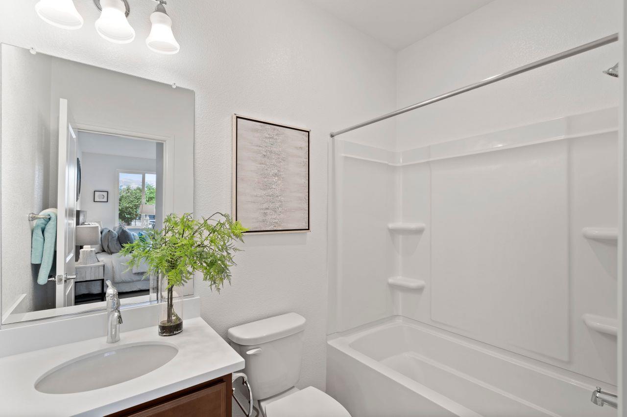 718 Fruit Ranch Loop San Jose, CA 95133 - Photo 26 of 36 a bathroom with a sink toilet a mirror and shower
