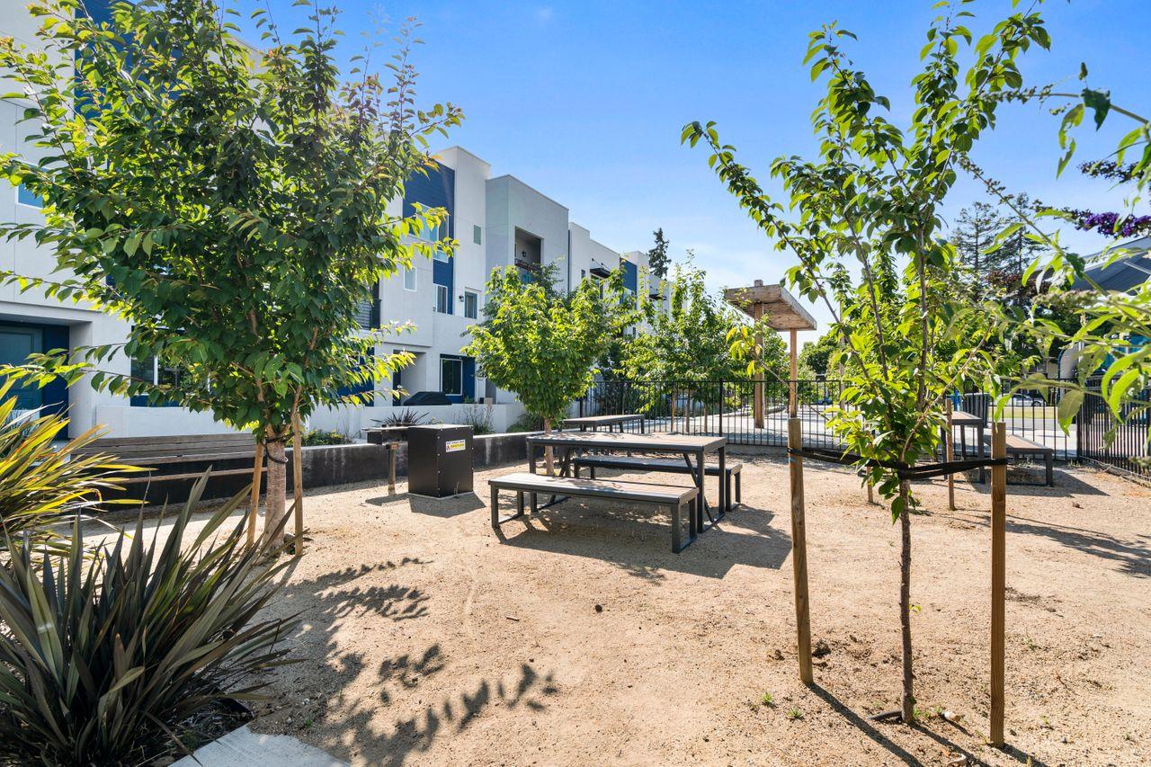 718 Fruit Ranch Loop San Jose, CA 95133 - Photo 33 of 36 a view of a patio with couches table and chairs and potted plants