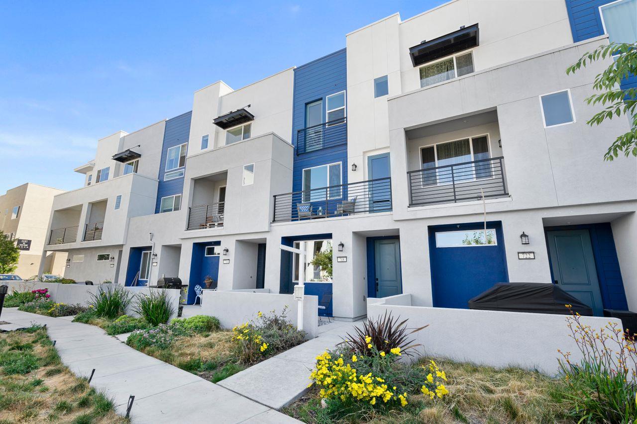 718 Fruit Ranch Loop San Jose, CA 95133 - Photo 4 of 36 a front view of a multi story residential apartment building