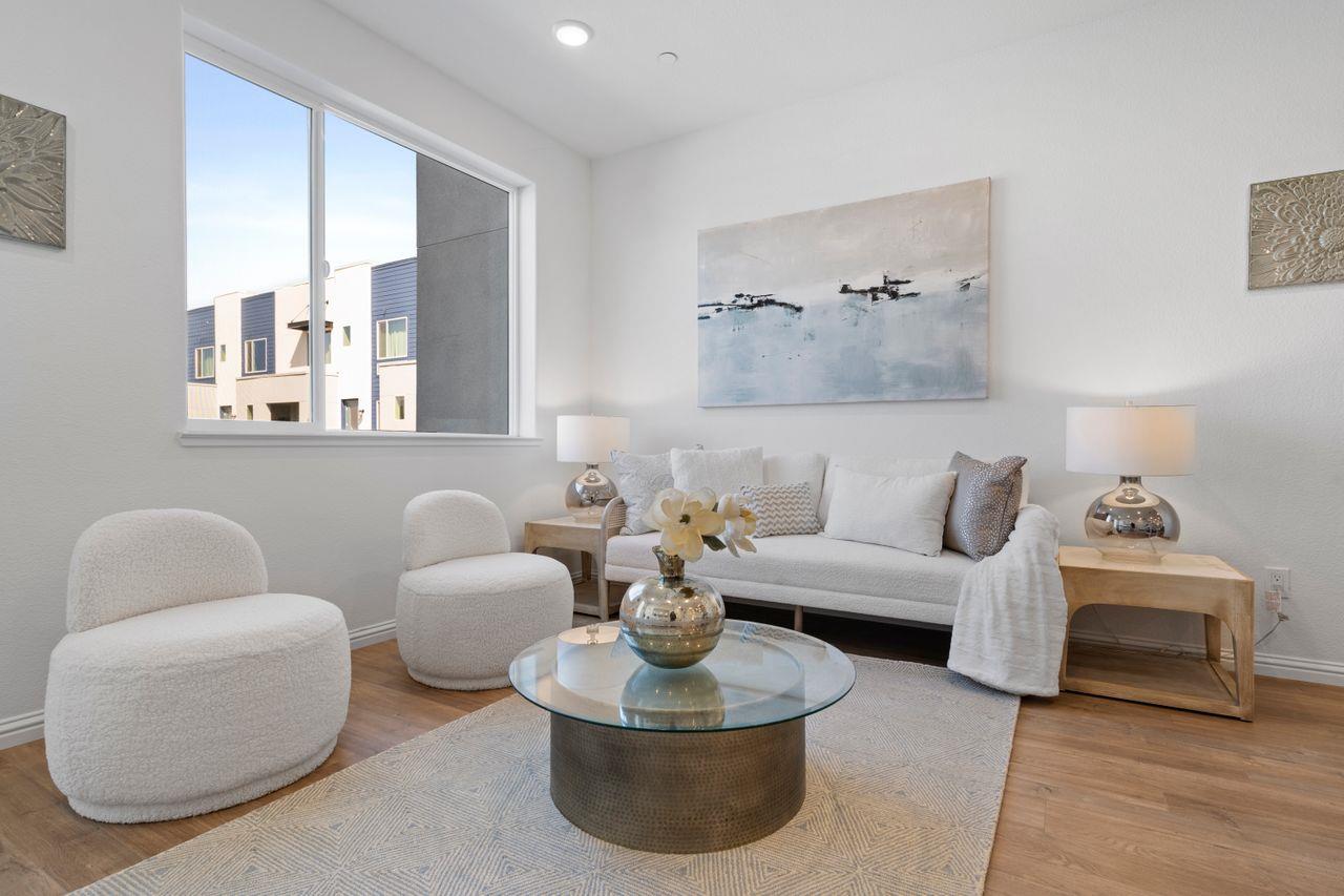 718 Fruit Ranch Loop San Jose, CA 95133 - Photo 7 of 36 a living room with furniture and a large mirror