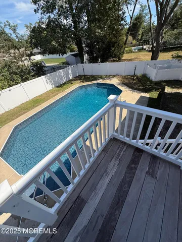 a balcony with wooden floor