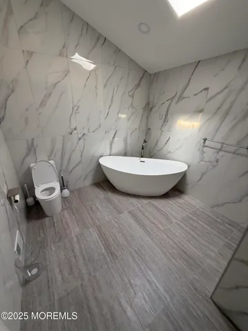 a bathroom with a toilet and a sink