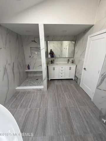 a bathroom with a sink and mirror