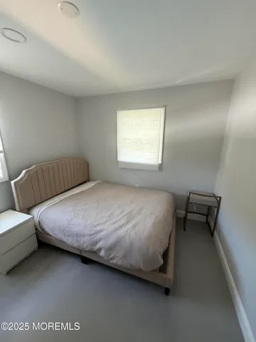 a bathroom with a glass door shower
