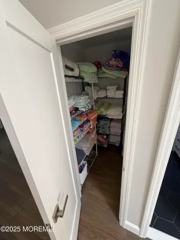 a view of wooden floor and windows in a room