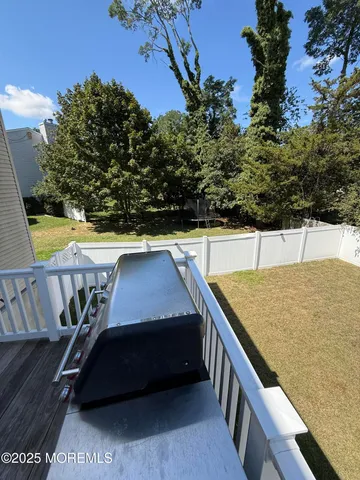 a balcony with table and chairs